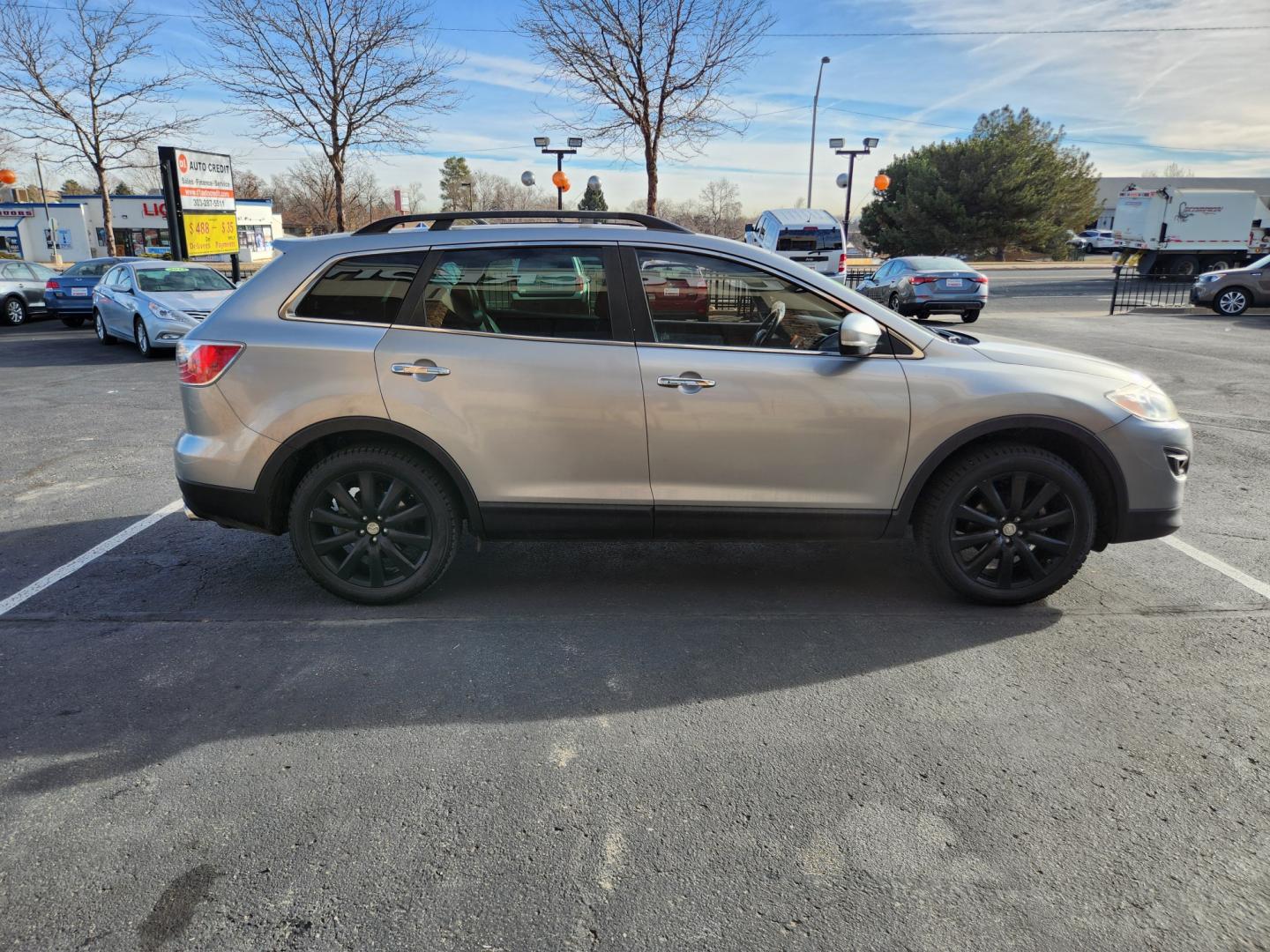 2010 Liquid Silver Metallic /Black Mazda CX-9 Grand Touring (JM3TB3MA6A0) with an 3.7L V6 DOHC 24V engine, Automatic transmission, located at 8595 Washington St., Thornton, CO, 80229, (303) 287-5511, 39.852348, -104.978447 - 2010 Mazda CX-9<br><br>D1 Auto NEVER charges dealer fees! All cars have clean titles and have been inspected for mechanical issues. We have financing for everyone. Good credit, bad credit, first time buyers.<br><br>Please call Lakewood Location 303-274-7692 or Thornton 303-287-5511 to schedule a tes - Photo#4